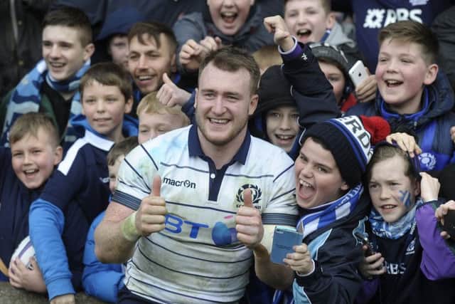 Scotland captain Stuart Hogg was happy to pose with young fans after the victory. Picture: Neil Hanna