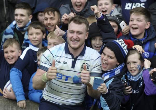 Scotland captain Stuart Hogg was happy to pose with young fans after the victory. Picture: Neil Hanna