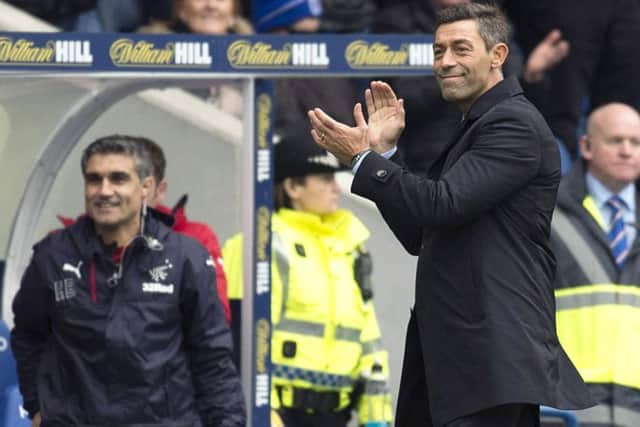 Pedro Caixinha celebrates his side's second goal. Picture: SNS/R