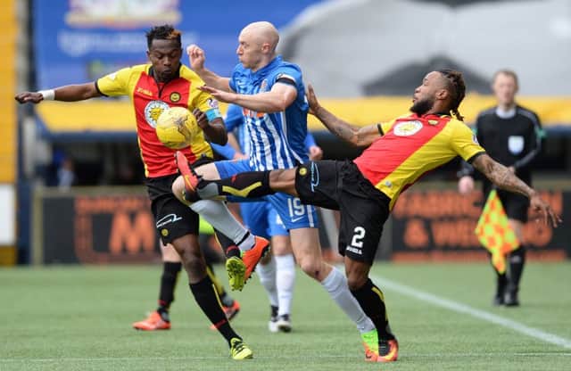Kilmarnock's Conor Sammon battles with Partick Thistle's Abdul Osman and Mustapha Dumbuya. Picture: SNS/Sammy Turner