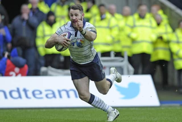 Tommy Seymour dives over for his try against Italy. Photograph: Neil Hanna