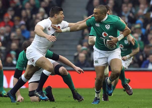 England's Ben Youngs attempts to tackle Ireland's Simon Zebo. Picture: PA Wire