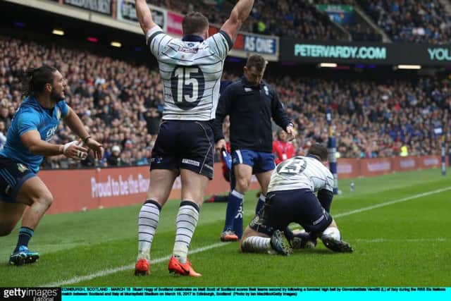 Stuart Hogg raises his arms in triumph as Matt Scott scores. Picture: Getty.