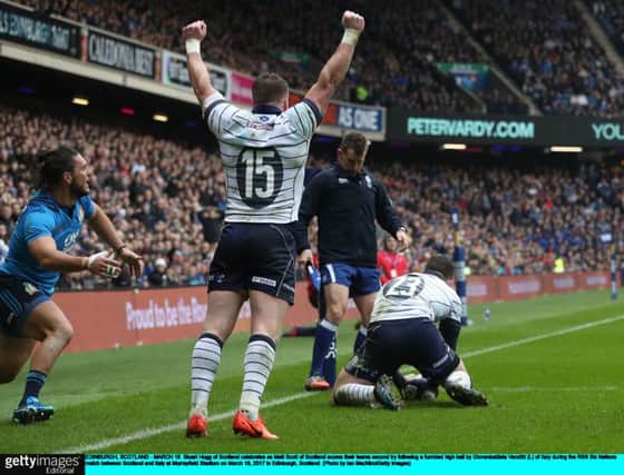 Stuart Hogg raises his arms in triumph as Matt Scott scores. Picture: Getty.