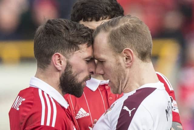 Aberdeen's Graeme Shinnie and Malaury Martin square up. Pic: SNS