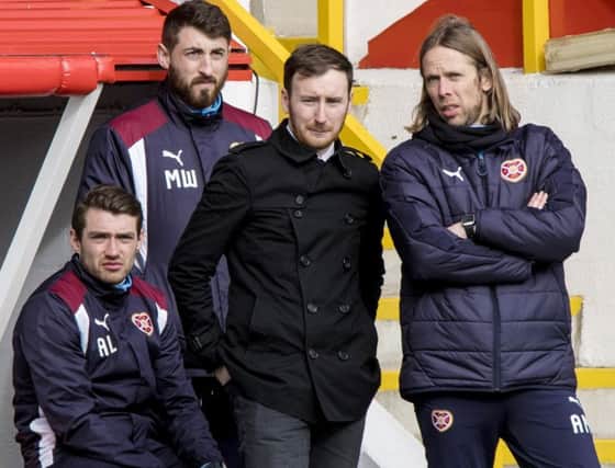 Hearts director of football Craig Levein passed messages to head coach Ian Cathro, centre, at Pittodrie. Picture: SNS.