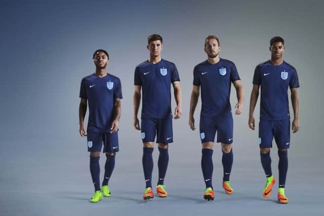 Raheem Sterling, John Stones, Harry Kane and Marcus Rashford model England's new away kit. Picture: PA