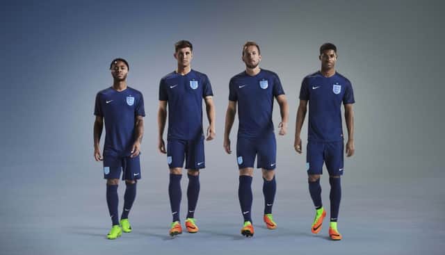 Raheem Sterling, John Stones, Harry Kane and Marcus Rashford model England's new away kit. Picture: PA