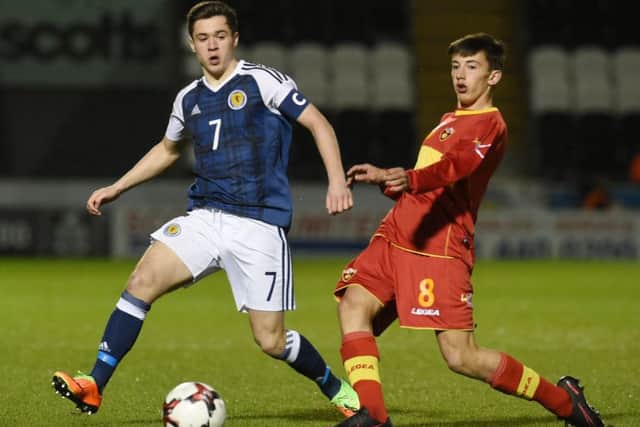 Celtic star Jack Aitchison battles for the ball while on Scotland under-17 duty. Picture: SNS