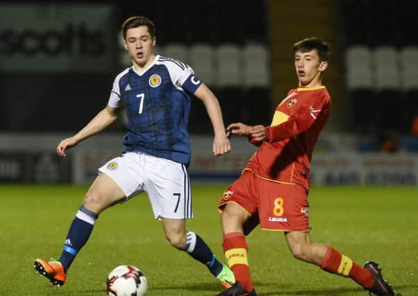 Celtic star Jack Aitchison battles for the ball while on Scotland under-17 duty. Picture: SNS