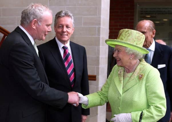 In a historic gesture the Queen shook the hand of Northern Ireland Deputy First Minister and former IRA commander Martin McGuinness in 2012.