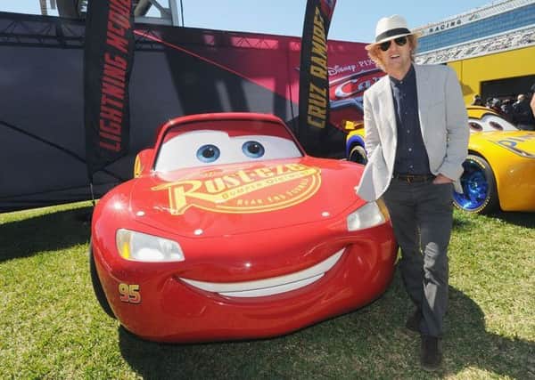 Owen Wilson, voice of Lightning McQueen in "Cars 3" poses with Lightning McQueen. Picture; Getty