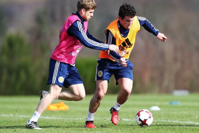 John McGinn, right, battles with Stuart Armstrong during Scotland training yesterday
