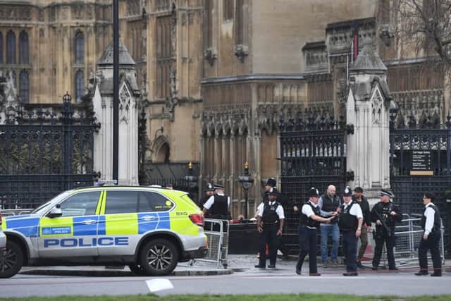 Police outside the Palace of Westminster, London. Picture: PA