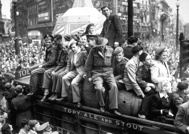 Crowds gather to rejoice at the end of the war on VE Day. Picture: Keystone/Getty Images