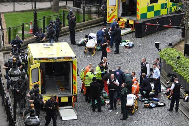 Emergency services at the scene outside the Palace of Westminster (Photo: Stefan Rousseau/PA Wire)