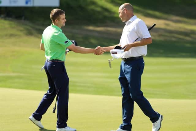Russell Knox shakes hands with Bill Haas after beating the American 3&2 in Texas. Picture: Getty Images