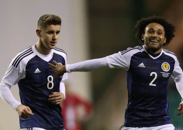 Tom Cairney, left, pictured alongside Ikechi Anya, impressed on his Scotland debut. Picture: Ian MacNicol/Getty Images