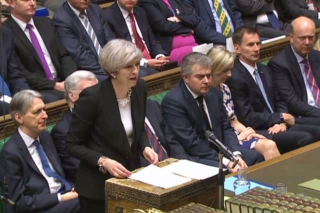 Theresa May addressing parliament