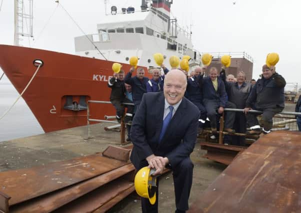 PIC Â© Sandy Young 07970 268944
Jim McColl unveiled his plans for the future of Ferguson Shipbuilders at a press conference in Port Glasgow today. With an investment of up to Â£8m, he will take on 80 employees by mid-November - most of whom had been laid off when the yard went into administration.
PICTURED Jim McColl with some of the workforce who have been re-employed.

www.scottishphotographer.com
sandyyoungphotography.wordpress.com
sj.young@virgin.net
07970 268 944