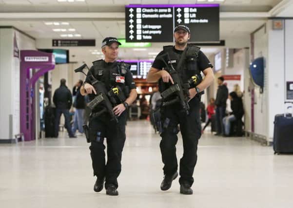 Armed policeman at Edinburgh Airport in Scotland. Picture: PA