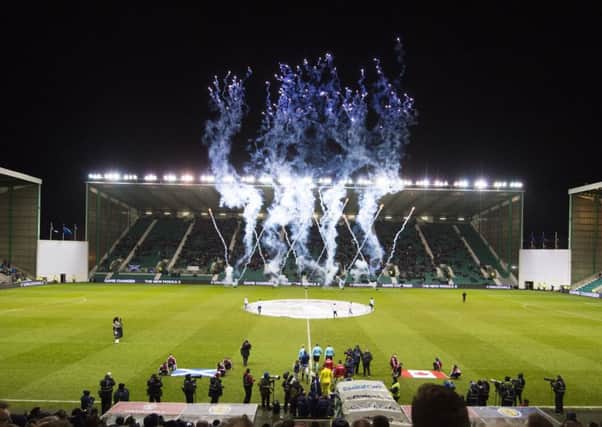 A massive waste of fireworks as the teams trudge out for the start of the game. Picture: SNS