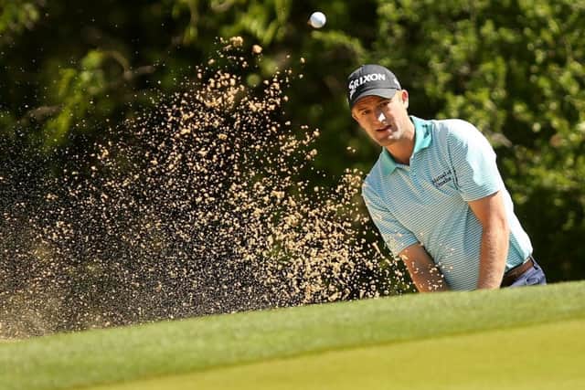 Russell Knox plays out of a bunker at the first hole during the second round of the World Golf Challenge Match Play in Texas.