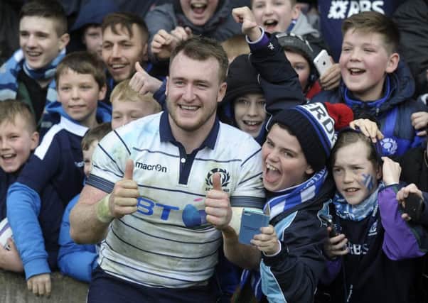 Stuart Hogg celebrates with some young Scotland fans after the win over Italy. Picture:

 Neil Hanna