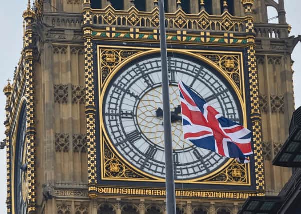 Union flags fly at half-mast in front of Big Ben as a mark of respect for the victims of the March 22 terror attack. Picture: AFP/Getty Images