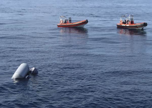 A sunken rubber boat discovered in the Mediterranean Sea off the Libyan coast (Proactiva Open Arms via AP)