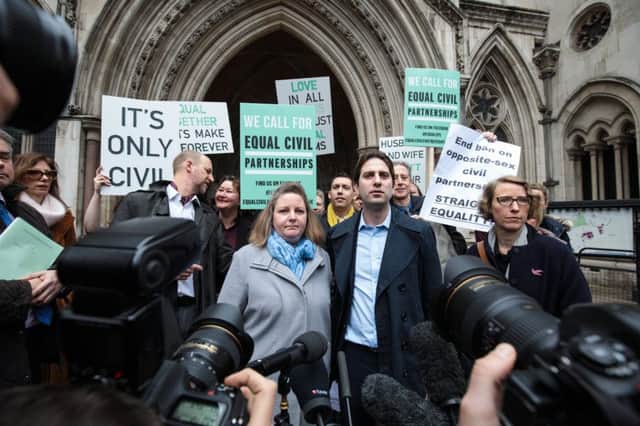 LONDON, ENGLAND - FEBRUARY 21: Charles Keidan (2nd R) and Rebecca Steinfeld (C) address the media outside the Royal Courts of Justice, Strand on February 21, 2017 in London, England. Mr Keidan and Ms Steinfeld have today lost their Court of Appeal battle to enter into a civil partnership. The couple were challenging a previous High Court ruling which said that they could not have a civil partnership because they were not in a same sex relationship. (Photo by Jack Taylor/Getty Images)