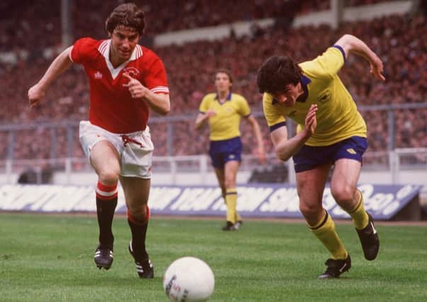 Man United's Martin Buchan, left, and Frank Stapleton of Arsenal chase the ball during the 1979 FA Cup final. Picture: Colorsport/REX/Shutterstock