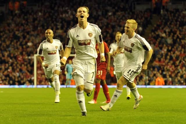 David Templeton, centre, after scoring against Liverpool at Anfield. Picture: Phil Wilkinson