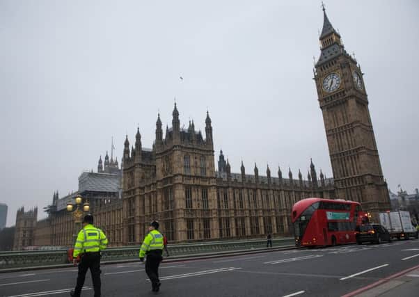 Police officers patrol on Westminster Bridge on Friday March 24. Picture: Getty Images