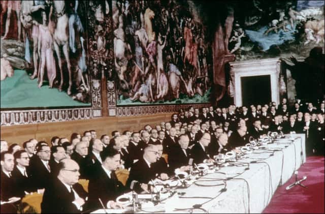 Ministers in Rome sign the treaties establishing the European Economic Community (the EEC) and European Atomic Energy Community (Euratom). From left to right P.H. Spaak and Jean-Charles Snoy  of Oppuers (Belgium), Christian Pineau and Maurice Faure (France), Konrad Adenauer and W. Hallstein (Germany), A. Segni and C. Martino (Italy), J. Bech and L. Schaus (Luxembourg), J.Luns and J. Linthorst Homan (Netherlands).