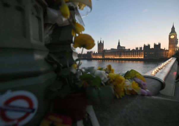 Flowers and candle lights on Westminster Bridge, following  the Westminster attack. Picture; PA