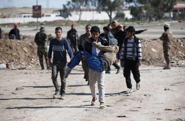 Displaced Iraqis flee their homes due to fighting between government troops and IS. Picture: AFP/Getty