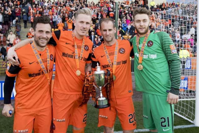 United's Tony Andreu, Nick Van Der Velden, Frank Van Der Struijk and Luis Zwick with the cup. Picture: Alan Harvey/SNS