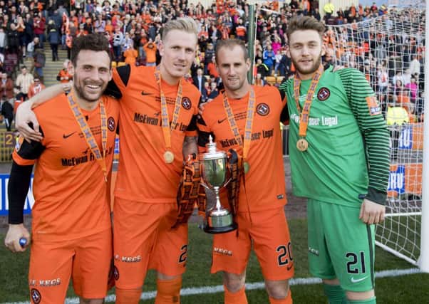 United's Tony Andreu, Nick Van Der Velden, Frank Van Der Struijk and Luis Zwick with the cup. Picture: Alan Harvey/SNS