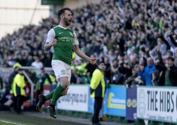 James Keatings celebrates scoring his goal in added time to seal Hibs 2-1 victory over Falkirk. Picture: SNS.