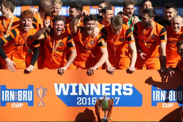 Dundee United celebrate after receiving the Irn Bru Challenge Cup. Picture: Getty.