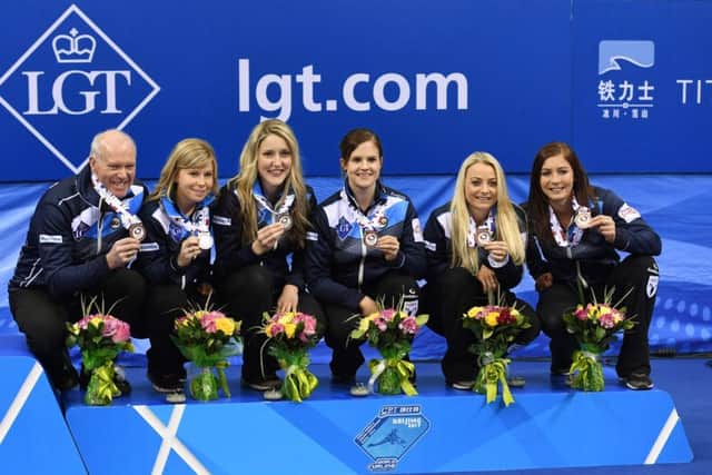 Scotland coach Howard Glenn and players Kelly Schafer, Lauren Gray, Vicki Adams, Anna Sloan and Eve Muirhead. Picture: AFP/Getty.