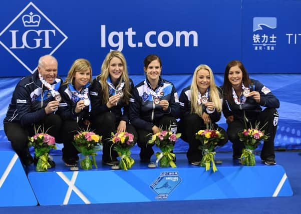 Scotland coach Howard Glenn and players Kelly Schafer, Lauren Gray, Vicki Adams, Anna Sloan and Eve Muirhead. Picture: AFP/Getty.