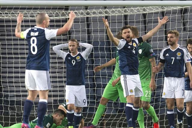 Russell Martin right, Leigh Griffiths and Scott Brown, left, appeal after Martins goal is disallowed. Picture: SNS.