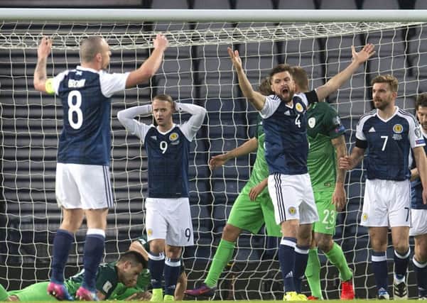 Russell Martin right, Leigh Griffiths and Scott Brown, left, appeal after Martins goal is disallowed. Picture: SNS.