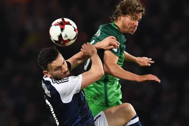Robert Snodgrass (left) battles for possession. Picture: SNS