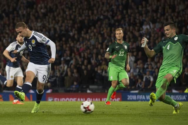 Leigh Griffiths fires a shot goalwards but was denied by the post. Picture: SNS.
