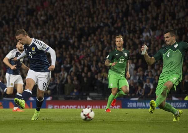 Leigh Griffiths fires a shot goalwards but was denied by the post. Picture: SNS.
