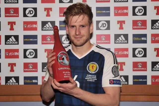 Scotland's Stuart Armstrong is awarded the man-of-the-match award. Picture: SNS