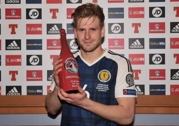 Scotland's Stuart Armstrong is awarded the man-of-the-match award. Picture: SNS